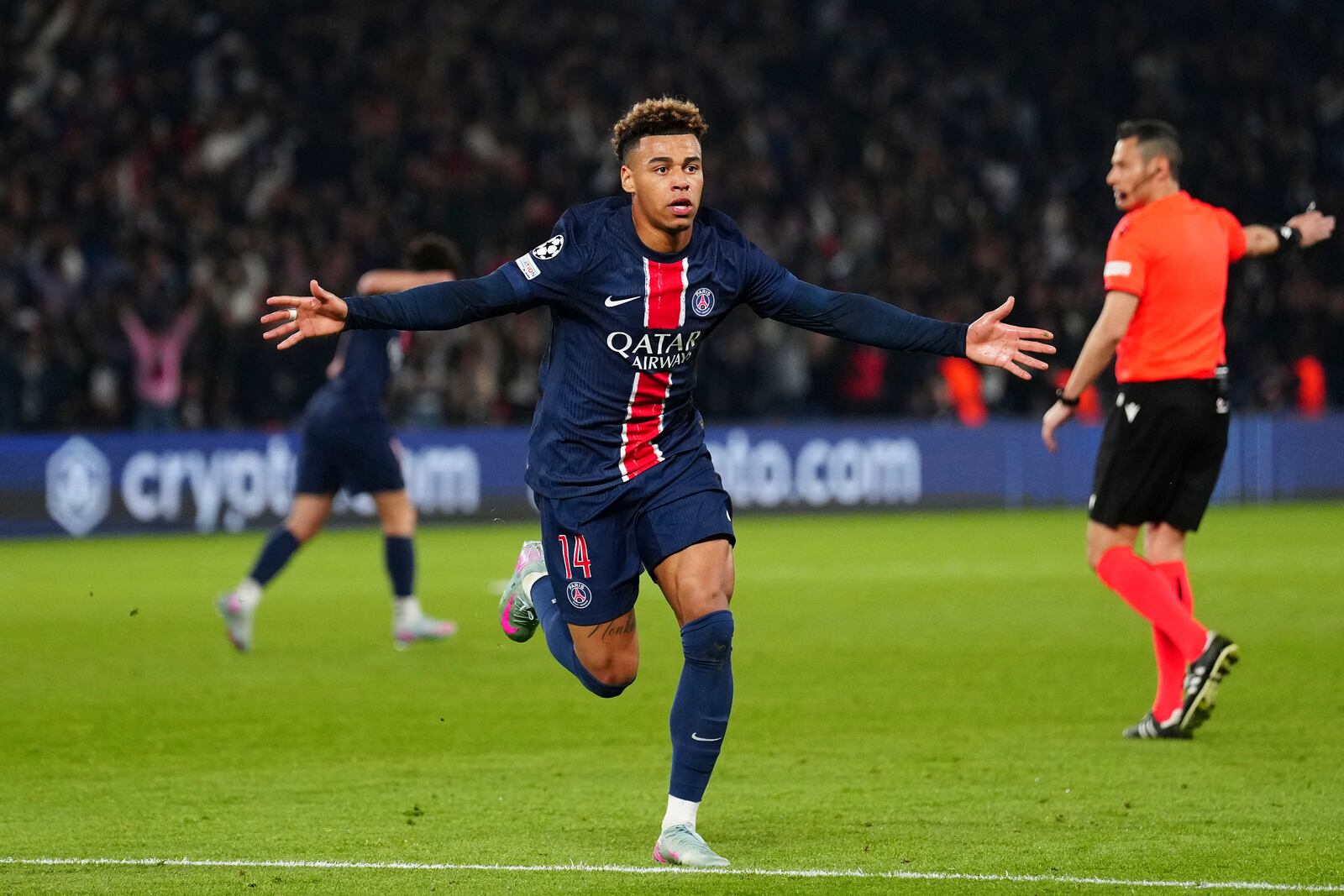 PSG's Desire Doue celebrates after scoring his side's first goal during the Champions League quarterfinal first leg soccer match between Paris Saint-Germain and Aston Villa at Parc des Princes stadium in Paris, Wednesday, April 9, 2025. (AP Photo/Aurelien Morissard)