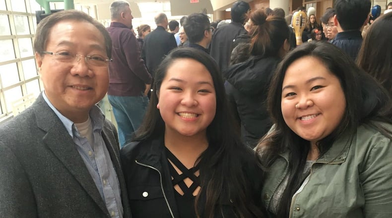 Thanh Huynh with his daughters Lana (middle) and Karen (right). CONTRIBUTED