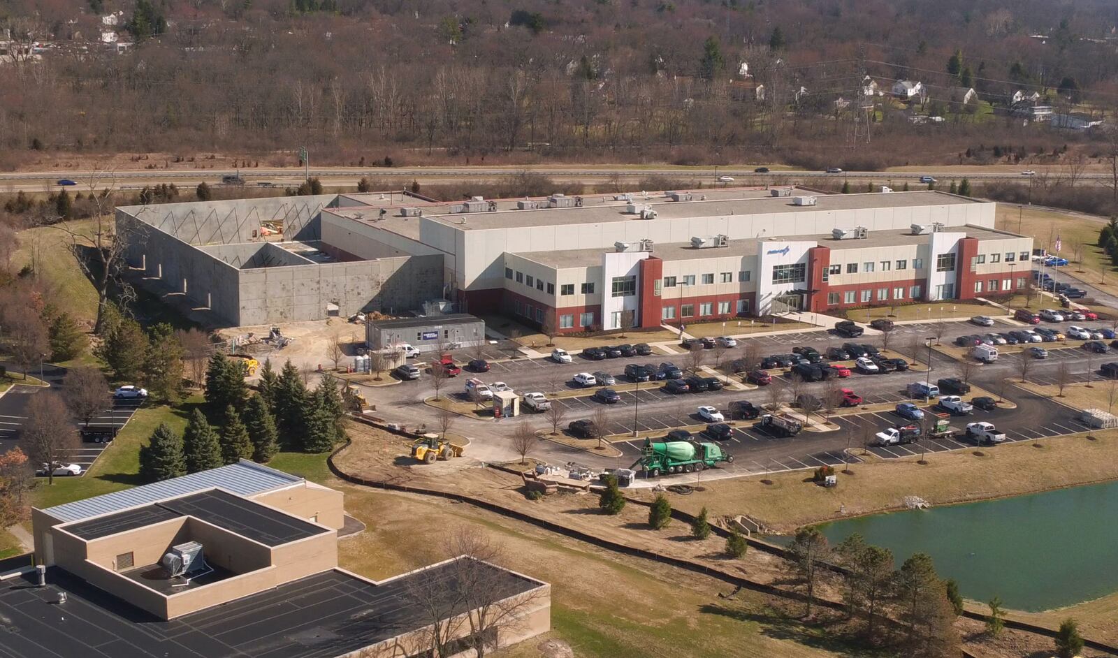 The 40,000-square-foot addition to defense contractor Orbital ATK in Beavercreek is taking shape.  Prefabricated concrete walls are in place for the new space which the company says will support their work on the classified B-21 Raider bomber which will replace the current B-2 Spirit stealth bomber.  Orbital ATKwas acquired by aerospace defense giant Northrop Grumman in 2017.   TY GREENLEES / STAFF