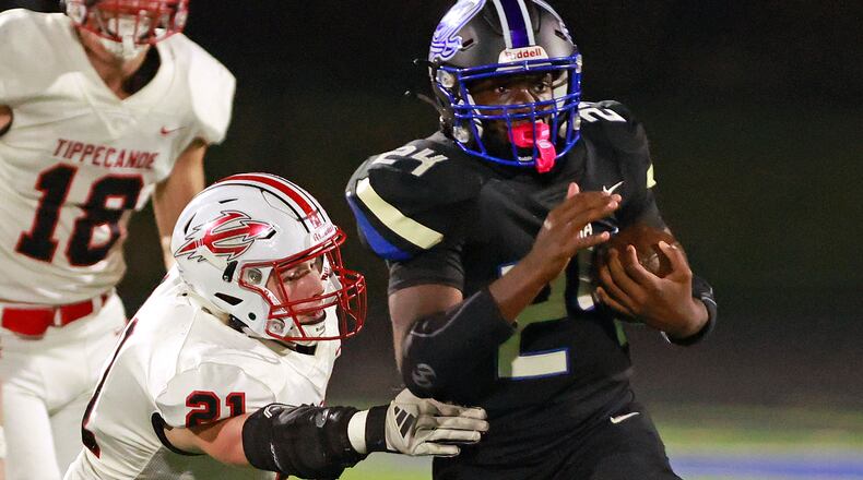 Xenia's Deaunte White, shown last week vs. TIppecanoe, scored a pair of TDs in the Buccaneers' playoff win over Sidney on Friday night. BILL LACKEY/STAFF