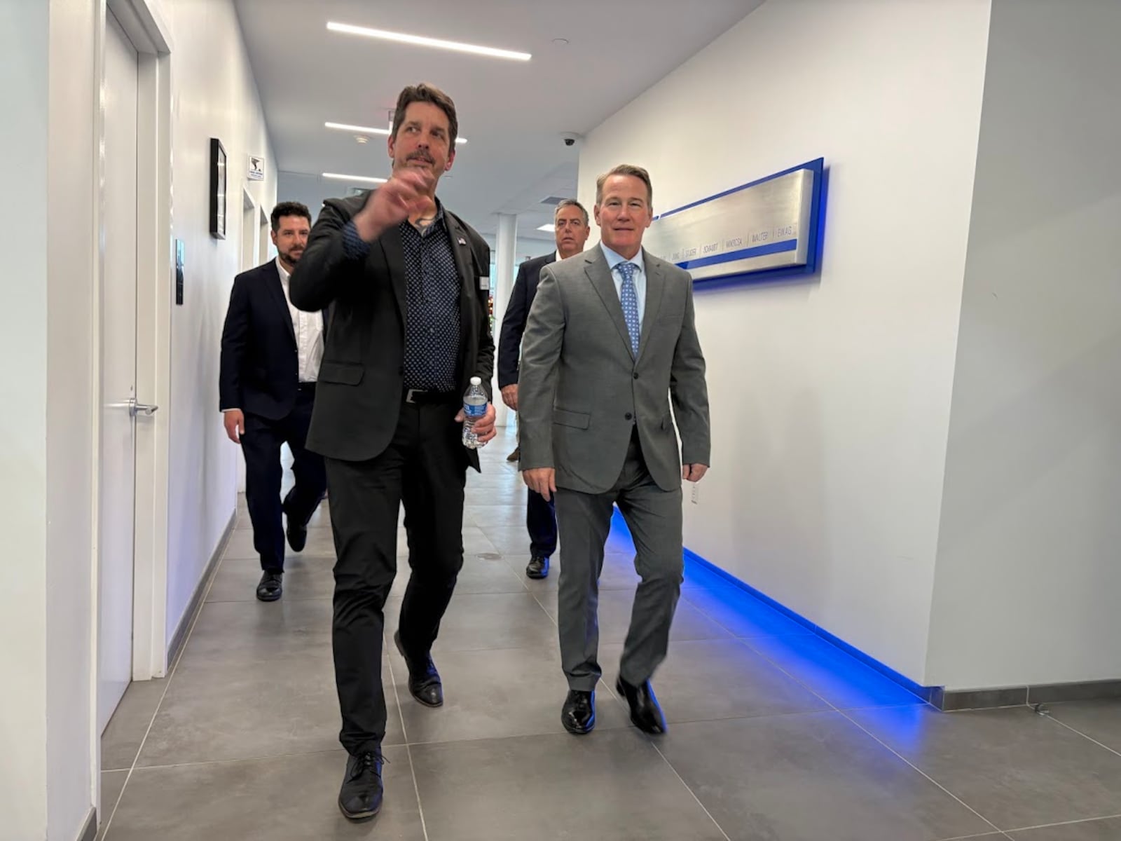 Markus Stolmar, left, guides Ohio Sen. Jon Husted on a tour of United Grinding North America in Miamisburg, where Stolmar is president and CEO, on Friday, Dec. 12, 2025. THOMAS GNAU/STAFF
