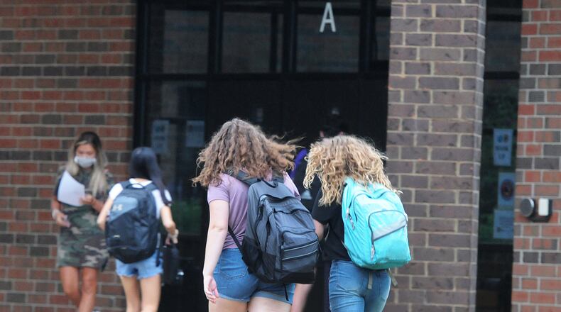 Students enter Bellbrook High School in August as the district returned to in-person classes. MARSHALL GORBY\STAFF