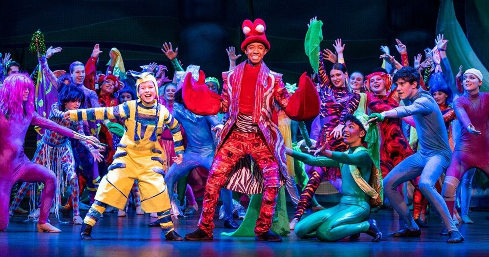 Mason Melvin (center as Sebastian) with Noah Mullen (left as Flounder) and the cast of Muse Machine's 2023 production of Disney's "The Little Mermaid." CONTRIBUTED