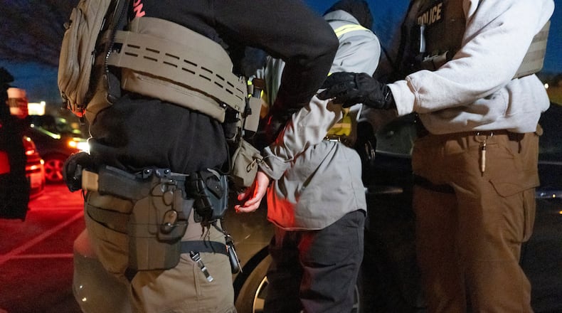 FILE - U.S. Immigration and Customs Enforcement officers detain a person, Jan. 27, 2025, in Silver Spring, Md. (AP Photo/Alex Brandon, File)