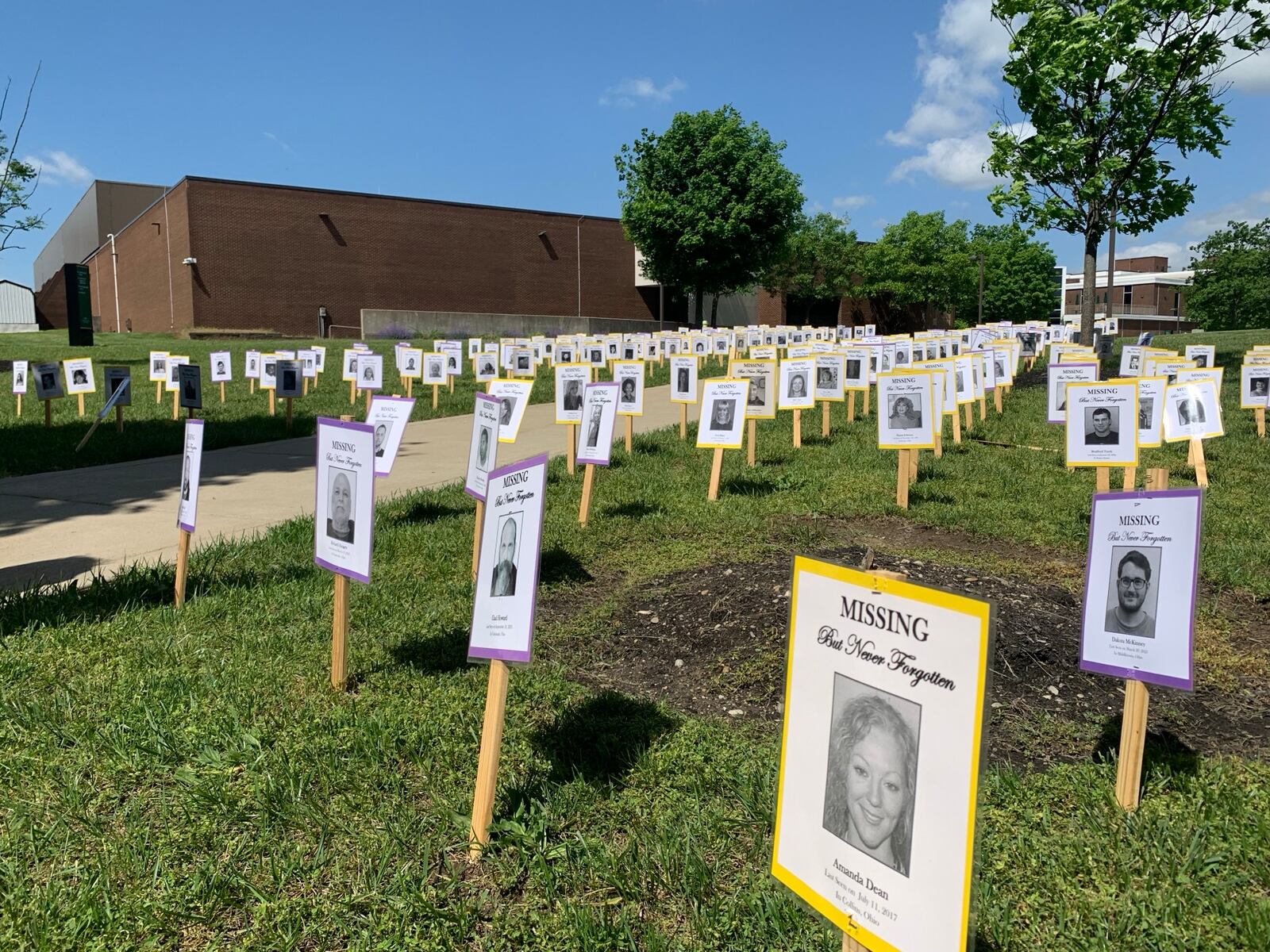 Posters of Ohio's missing adults and children assembled on the lawn of Wright State University, Saturday May 17, 2025 in recognition of MIssing Persons Day. LONDON BISHOP/STAFF