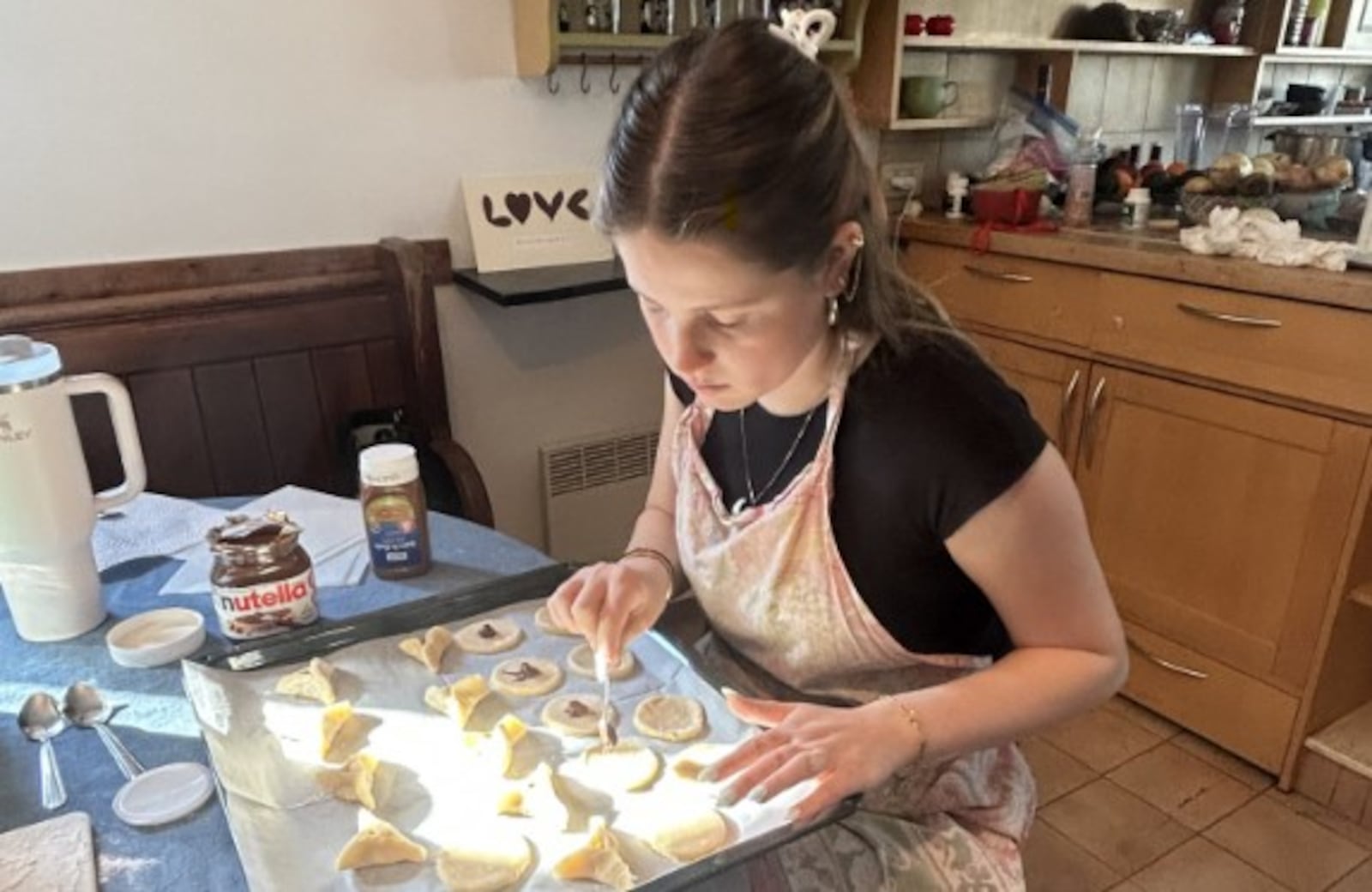Heleni Moss, great-niece of Dayton Daily News Writer Meredith Moss, makes Hamantaschen,  a Purim cookie.
SASKIA SWENSON/CONTRIBUTED