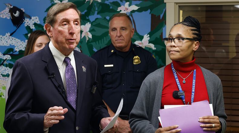 Montgomery County County Prosecutor Mat Heck, left, Dayton Police Department Maj. Brian Johns and Sgt. Roberta Bailey discuss Project Comfort, Wednesday, Oct. 2, 2024 at the Family Justice Center. The program is aimed at helping domestic survivors and their childern. MARSHALL GORBY\STAFF