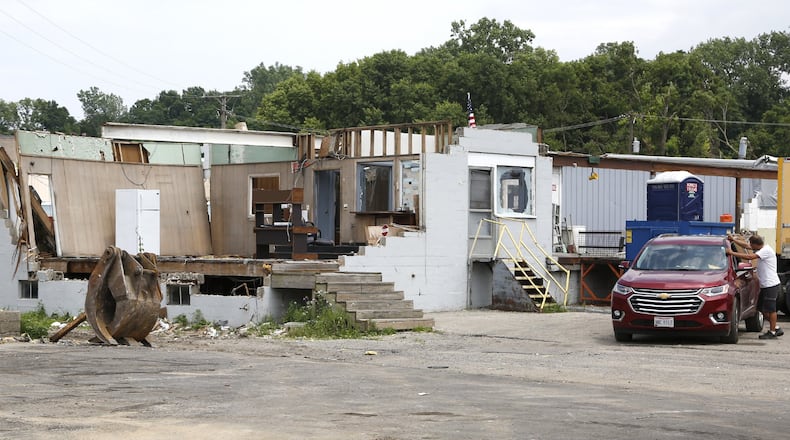 King’s Transfer owner Dan King ran his trucking business from his SUV after the Memorial Day tornado ripped through his business on San Jose Avenue in Dayton. Many of King’s vehicles were damaged. TY GREENLEES / STAFF