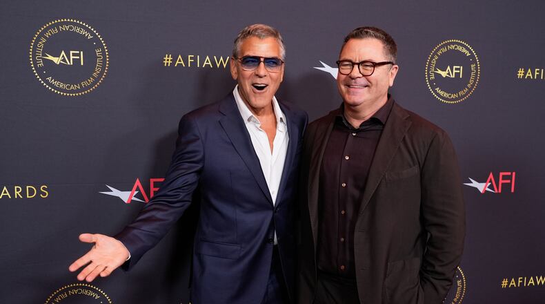 Actors George Clooney, left, and Nick Offerman pose together at the AFI Awards at the Four Seasons in Los Angeles, Friday, Jan. 9, 2026. (AP Photo/Chris Pizzello)