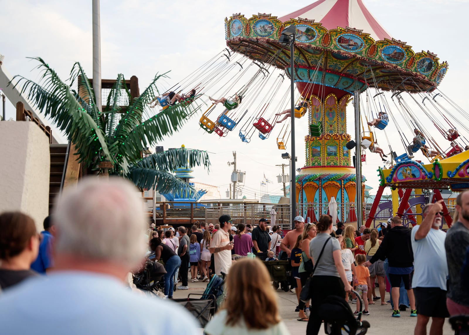 People enjoy Playland's Castaway Cove amusement park, in Ocean City, N.J, on Friday, June 6, 2025. (AP Photo/Mingson Lau)