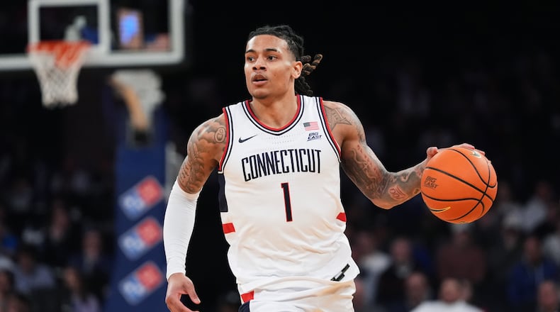 UConn's Solo Ball (1) looks to pass during first half of an NCAA college basketball game against Xavier in the quarterfinals of the Big East basketball tournament Thursday, March 12, 2026, in New York. (AP Photo/Frank Franklin II)