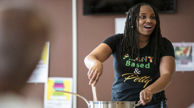 Monique Koch, a vegan family coach and the Brown Vegan on YouTube, leads a class at Vegan SoulFest in Baltimore, Aug. 26, 2017. Vegan cooking and eating are having a renaissance among black Americans, driven in part by movements like Black Lives Matter, documentaries like "What the Health,"and a growing cadre of people who connect personal health, animal welfare and social justice with the fight for racial inequality. (Nate Pesce/The New York Times)