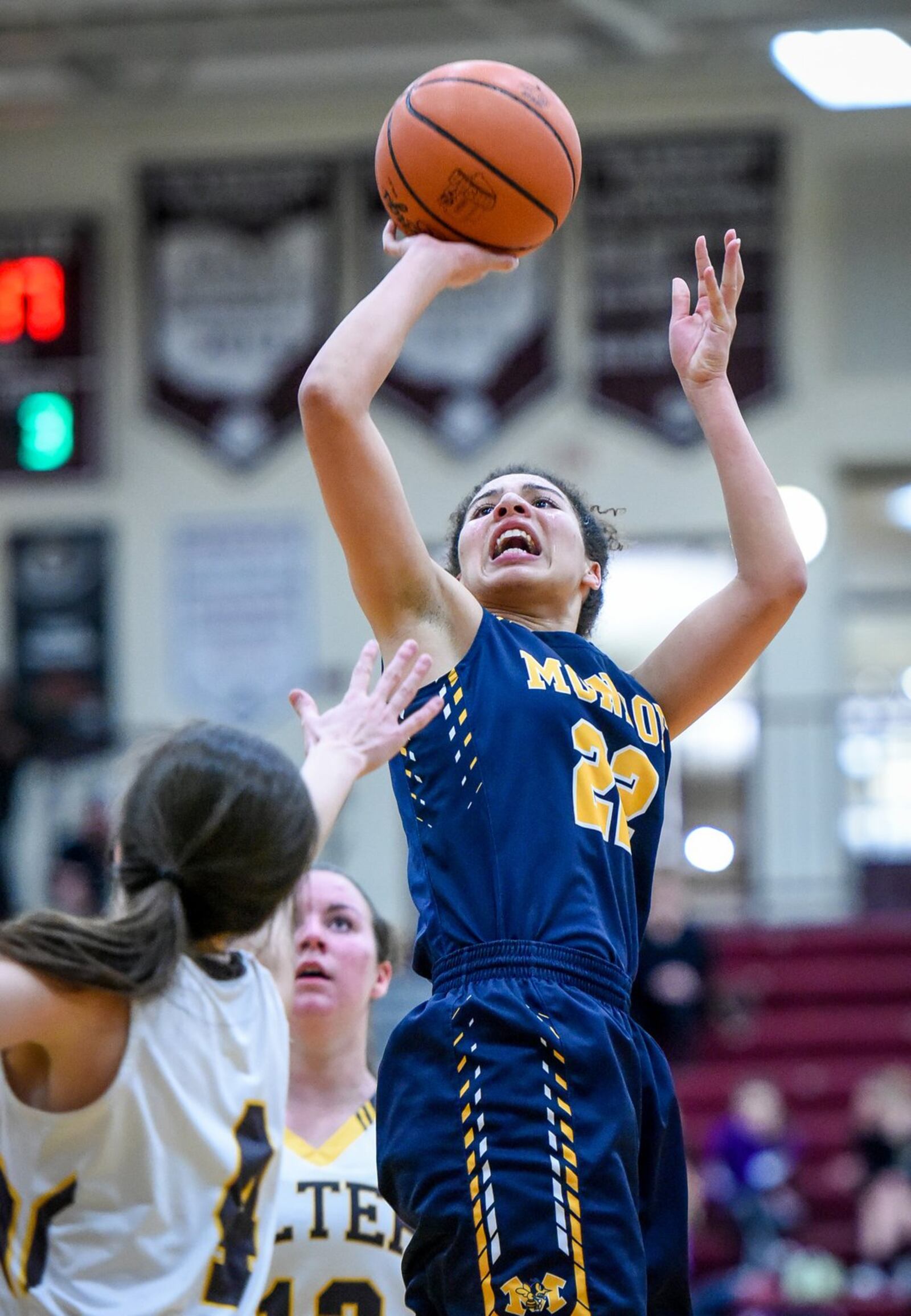 Monroe’s Jahsalyn Robinson puts up a jumper over Alter’s Lauren Lush during their Division II sectional final Thursday night at Lebanon. NICK GRAHAM/STAFF
