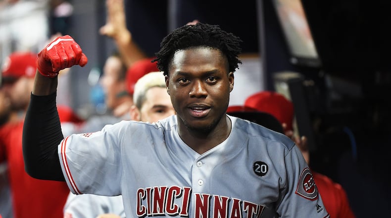 Aristides Aquino of the Cincinnati Reds celebrates after hitting game tying 3-run home run against the host Atlanta Braves at SunTrust Park on Saturday, Aug. 23, 2019. (Photo by Logan Riely/Getty Images)