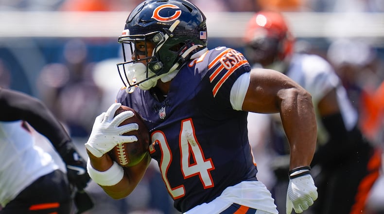 Chicago Bears running back Khalil Herbert (24) runs with the ball during the first half of an NFL preseason football game against the Cincinnati Bengals, Saturday, Aug. 17, 2024, at Soldier Field in Chicago. (AP Photo/Erin Hooley)