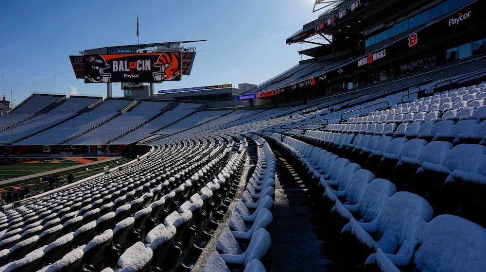 Stadium seats are covered in snow before an NFL football game between the Cincinnati Bengals and the Baltimore Ravens, Sunday, Dec. 14, 2025, in Cincinnati. (AP Photo/Carolyn Kaster)