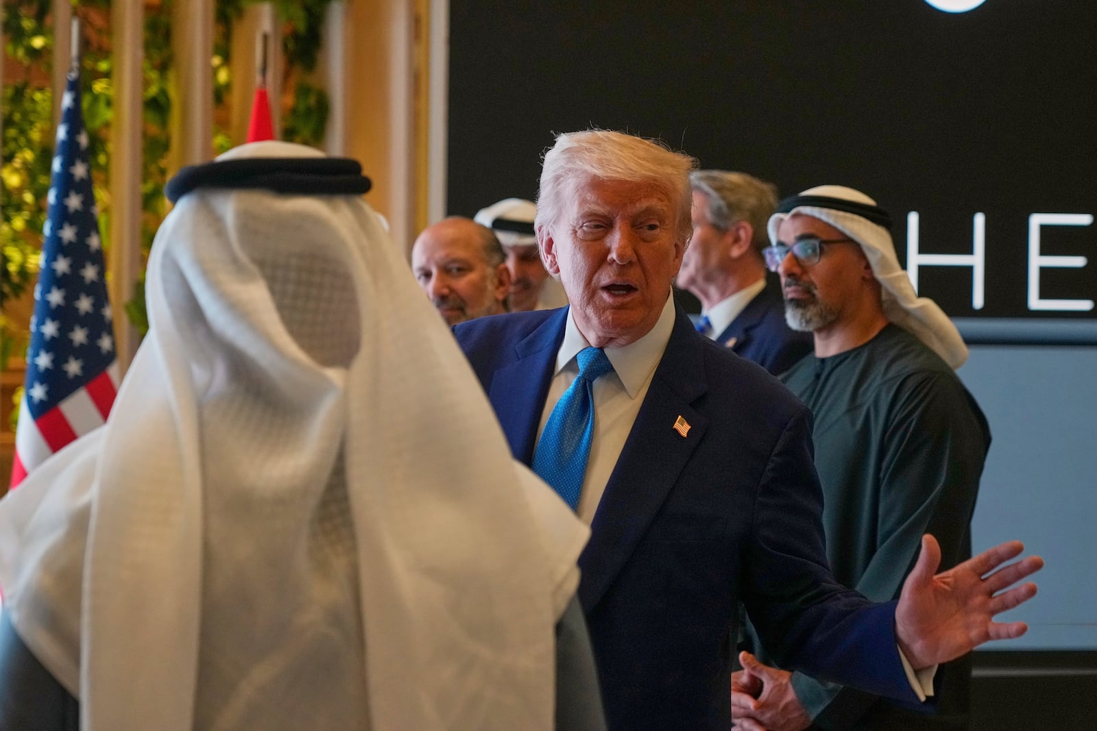President Donald Trump attends a business meeting and roundtable at Qasr Al Watan, in Abu Dhabi, United Arab Emirates Friday, May 16, 2025. At right is Crown Prince of Abu Dhabi Sheikh Khaled Bin Mohamed Bin Zayed Al Nahyan.(AP Photo/Altaf Qadri)