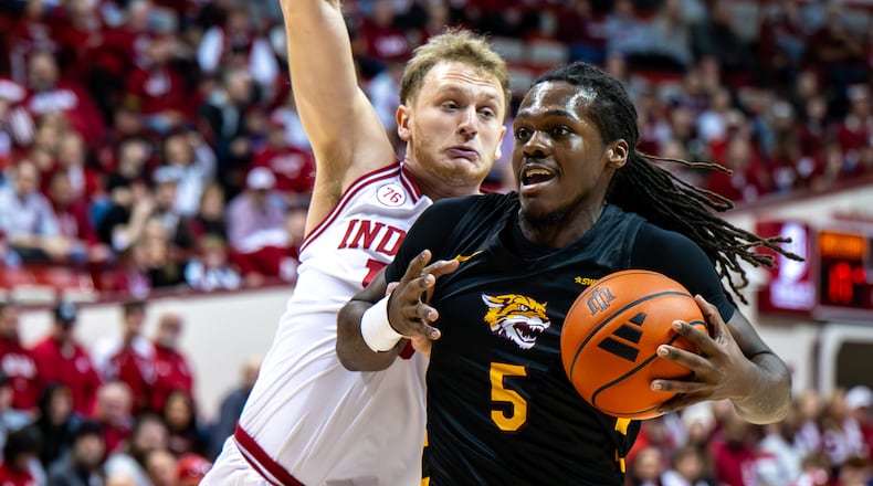 Bethune-Cookman forward Quentin Heady (5) is defended by Indiana forward Tucker Devries (12) during the first half of an NCAA college basketball game, Saturday, Nov. 29, 2025, in Bloomington, Ind. (AP Photo/Doug McSchooler)