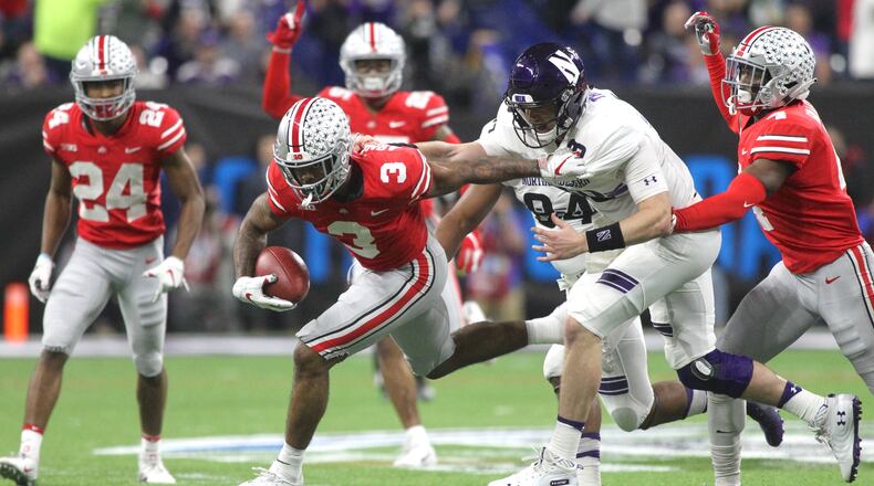 Ohio States Damon Arnette returns an interception against Northwestern in the Big Ten Championship on Saturday, Dec. 1, 2018, at Lucas Oil Stadium in Indianapolis. David Jablonski/Staff