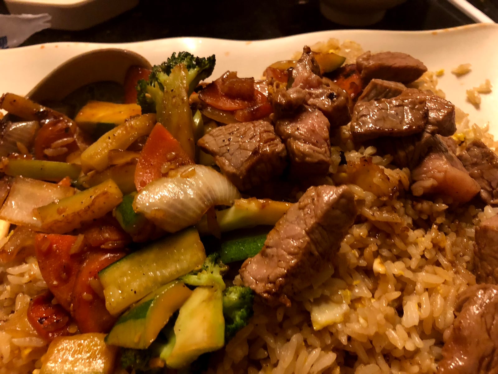 Dinner is the show at Osaka Japanese Steakhouse in Beavercreek near Dayton. The restaurant's  dinning room has several hibachi tables. Sushi and other Japanese favors are on the menu.  The walls are covered in hundreds of photos of customers celebrating anniversaries and birthdays.