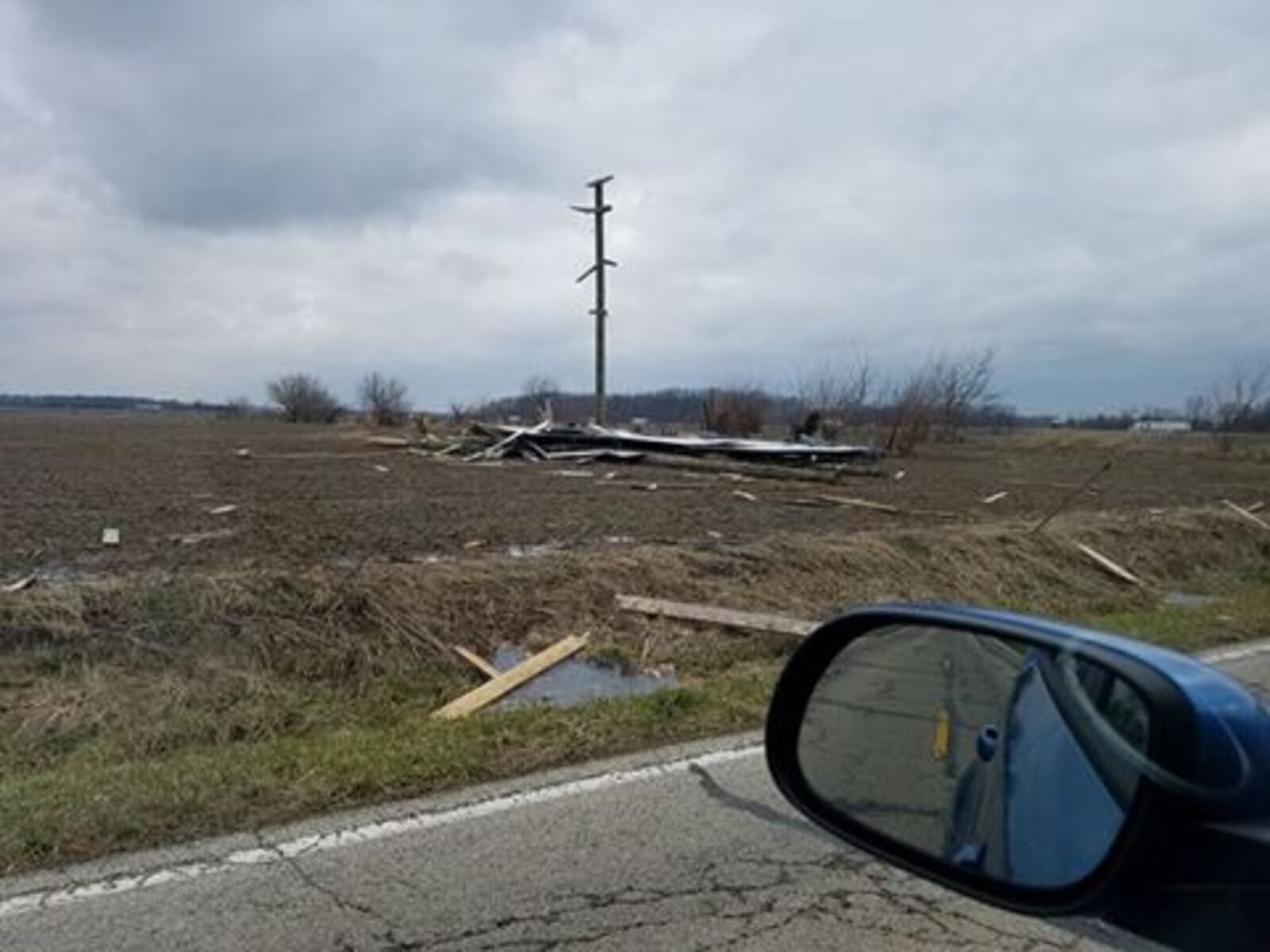 This is what is left of the Waffle House billboard in Preble County at the Interstate 70 overpass, shown on March 1, 2017. Debris is scattered across the road. VICTORIA WRIGHT / CONTRIBUTED