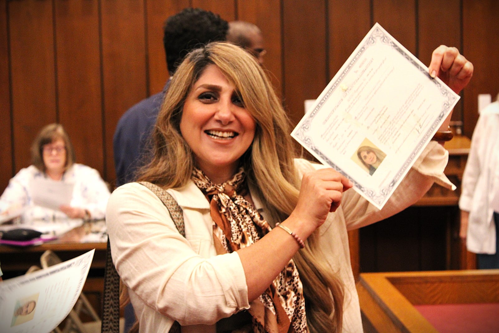 Samaneh Faramarzi was among new citizens naturalized at the Aug. 21 naturalization ceremony at Dayton's federal court building. She and her family came from Iran. SYDNEY DAWES/STAFF