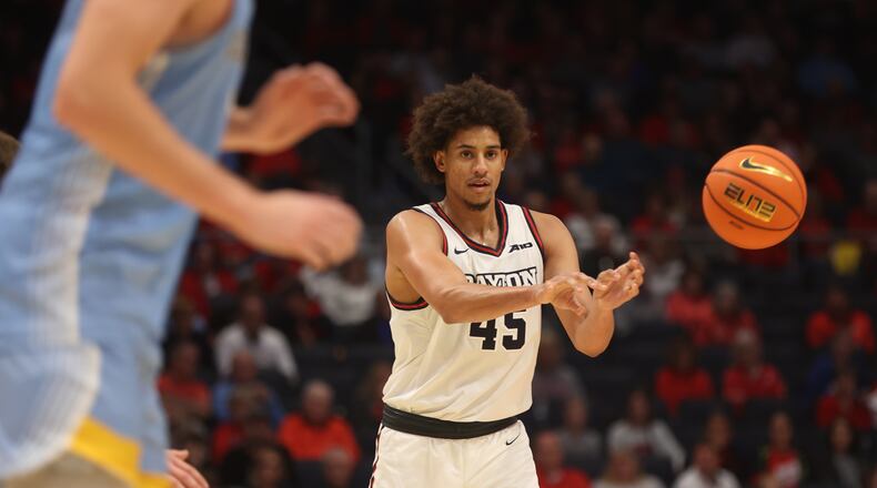 Dayton's Zimi Nwokeji makes a pass against Cedarville in an exhibition game on Saturday, Oct. 28, 2023, at UD Arena. David Jablonski/Staff