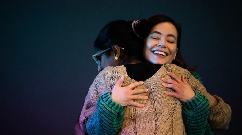Two attendees hug during a recent Project Blackbird viewing and discussion panel event. Wright State University will be hosting an upcoming Project Blackbird event on March 19, which will be a free event focusing on destigmatizing discussions around mental health. COURTESY OF PROJECT BLACKBIRD