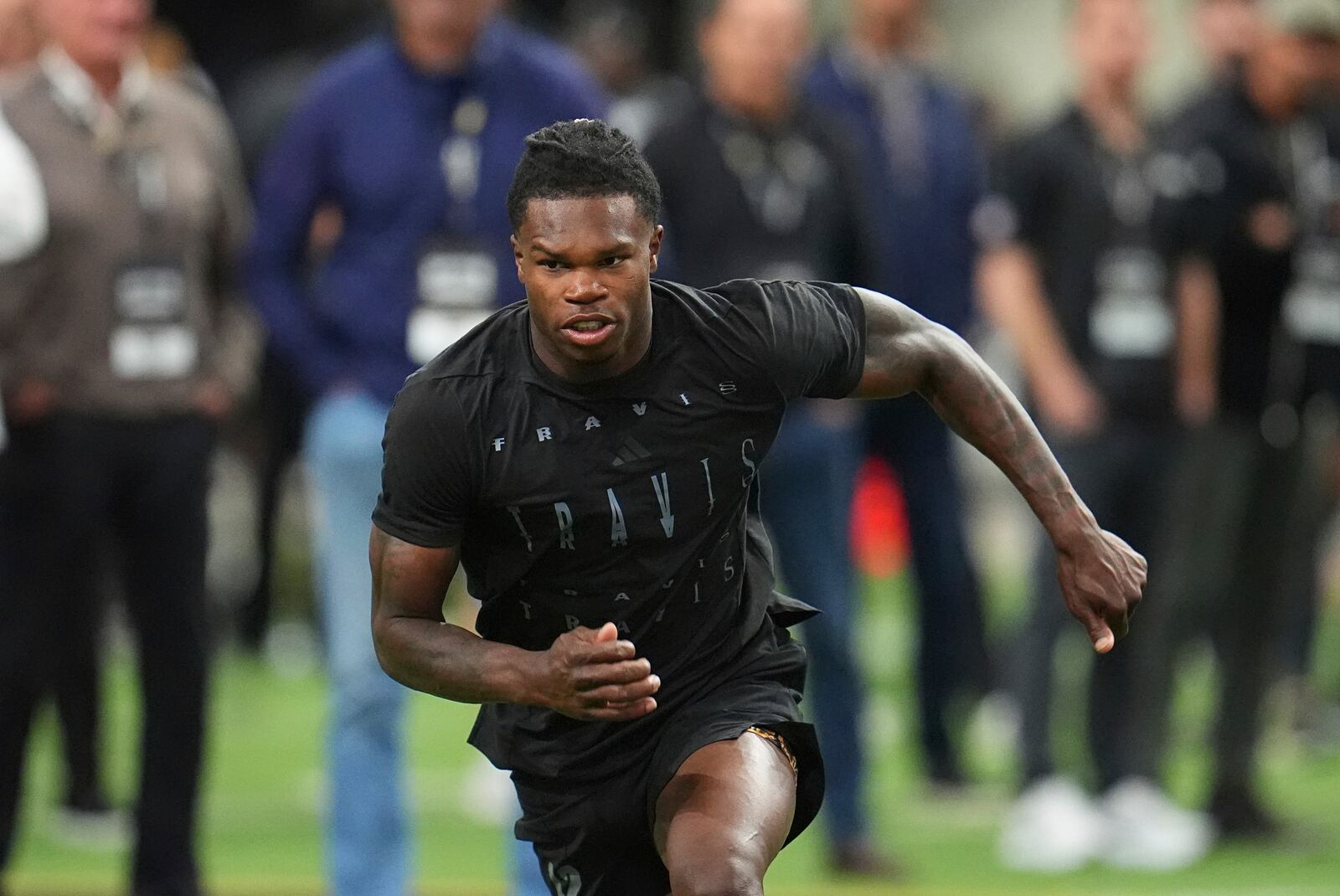 Colorado wide receiver Travis Hunter takes part in passing drills during Colorado's NFL football pro day Friday, April 4, 2025, in Boulder, Colo. (AP Photo/David Zalubowski)