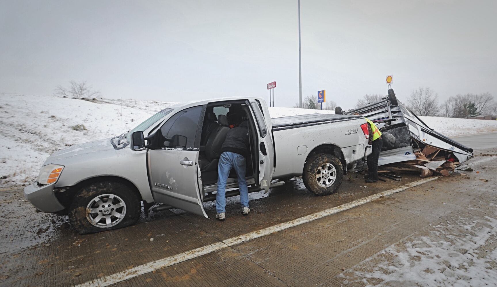 I-70 west ramp closes after trailer rolls over due to slick roads