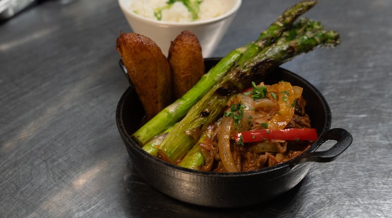 A ropa vieja dish from Cuba Libre Restaurant and Rum Bar's GLP-Wonderful menu is prepared for serving at the restaurant in Philadelphia, on Friday, March 6, 2026. (AP Photo/Mingson Lau)