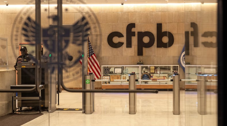 FILE - A security officer works inside of the Consumer Financial Protection Bureau (CFPB) building headquarters, Feb. 10, 2025, in Washington. (AP Photo/Jacquelyn Martin, File)