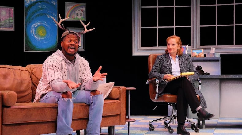 Rico Romalus Parker (left as Blitzen) and Teri Clark Linden (Dr. Arbor) star in the Human Race Theatre Company's world premiere of "Reindeer Sessions." PHOTO BY HUMAN RACE THEATRE COMPANY