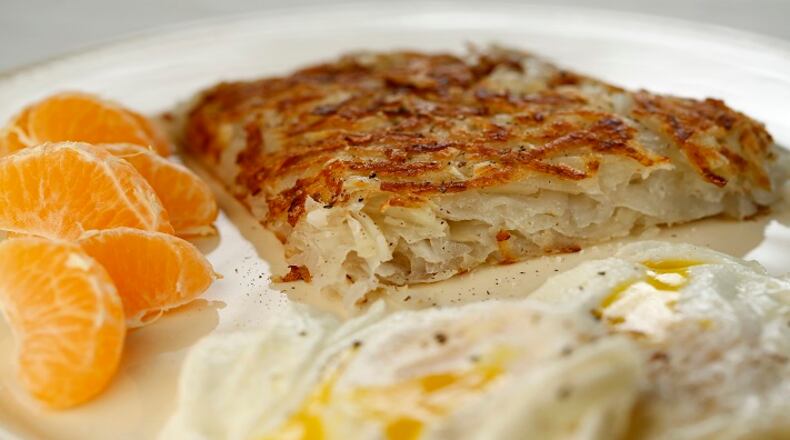Browned and crispy outside, soft and yielding inside, your perfect hash browns will make your eggs proud. (Michael Tercha/Chicago Tribune/TNS)