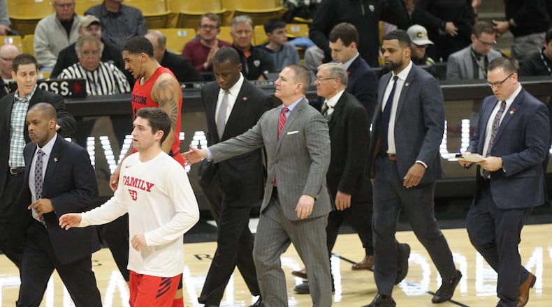 Donnie Jones, center, walks off the court with the rest of the coaching staff at halftime of a game against Colorado in the first round of the NIT on March 19, 2019, at the CU Events Center in Boulder, Colo.