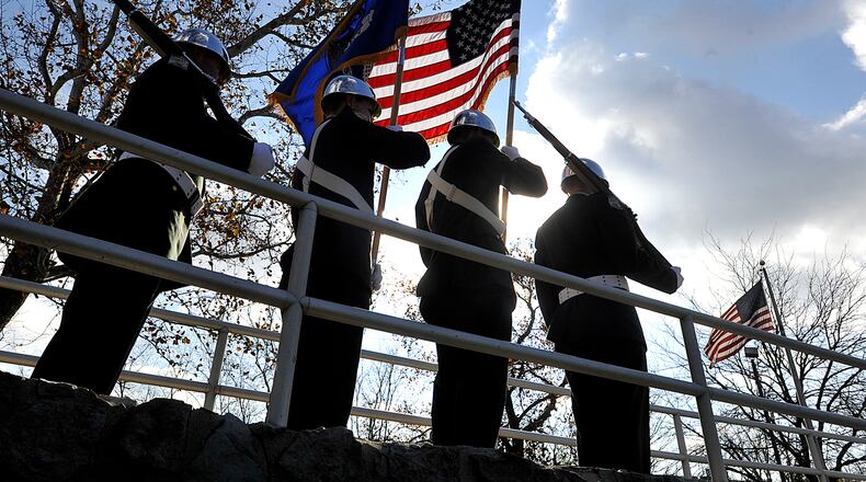 Members of the Wright State University ROTC present the colors during the Clark County Veterans Day program in 2020 at Veterans Park in Springfield. Staff photo by Bill Lackey