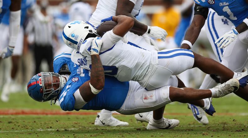 Mississippi defensive tackle Walter Nolen (2) tackles Kentucky running back Demie Sumo-Karngbaye (0) during the first half of an NCAA college football game against Kentucky Saturday, Sept. 28, 2024, in Oxford, Miss. (AP Photo/Randy J. Williams)