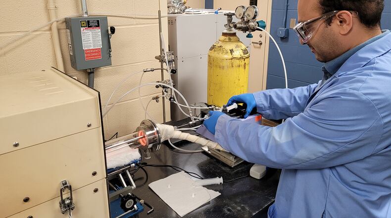 A researcher works on treating PFAS at University of Dayton's Research Institute.