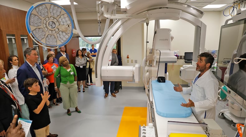 File - Neurologist Dr. Jody Short explains Mercy Health's new Interventional Neurology Suite at Springfield Regional Medical Center Wednesday, Sept. 6, 2023 during an open house and ribbon cutting for the new facility. The suite features a biplane angiography, an advanced, minimally invasive technology used to diagnose and treat strokes as well as other neurological conditions. Heading into 2025, industry experts say there is going to be a continued and increased focus on how technology can advance patient care. BILL LACKEY/STAFF