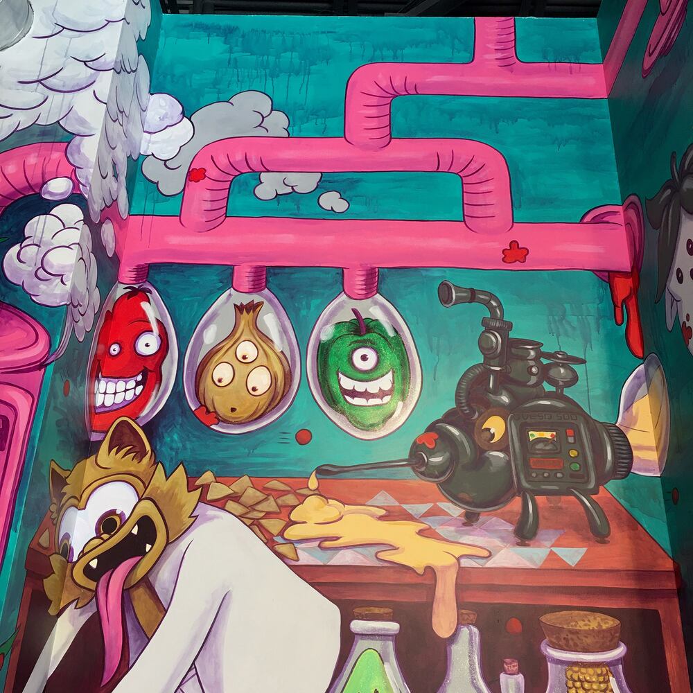 PHOTOS: Wild and wacky murals take over new restaurant at The Greene
