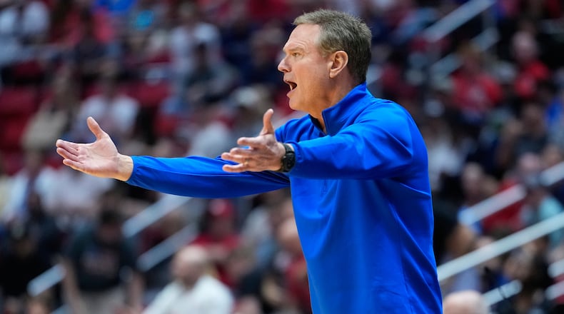 Kansas head coach Bill Self motions towards the court during the first half of a game between Kansas and St. John's in the second round of the NCAA college basketball tournament Sunday, March 22, 2026, in San Diego. (AP Photo/Mark J. Terrill)