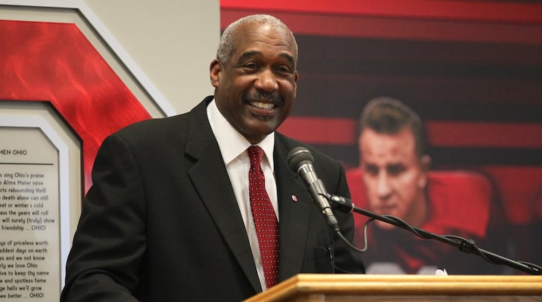According to an ESPN report, Ohio State Athletic Director Gene Smith will help decide which college football teams get to compete for the national championship — whether Michigan coach Jim Harbaugh likes it or not. DAVID JABLONSKI / STAFF