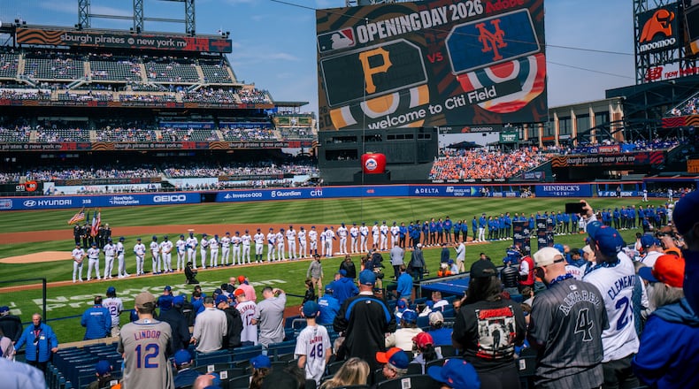 Players line up for introductions during an opening-day baseball game between the New York Mets and the Pittsburgh Pirates, Thursday, March 26, 2026, in New York. (AP Photo/Angelina Katsanis)
