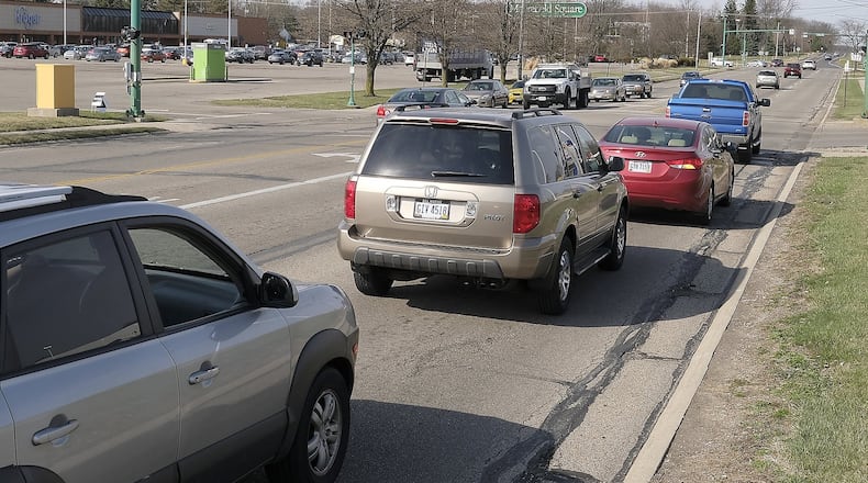 A controversial $1.8 million project to reduce Derr Road from four lanes to three lanes and add designated bike lanes on the roadway was approved to move forward on Aug. 29, despite opposition from community members. However, the Springfield City Commission could stop the project after more information is released during the design phase, commissioners said. Bill Lackey/Staff