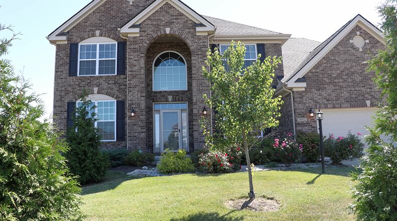 The brick-and-frame, 2-story has about 2,950 sq. ft. of living space, plus the finished basement. The home offers 4 bedrooms, 4 full baths and an attached, 2-car garage. CONTRIBUTED PHOTO BY KATHY TYLER