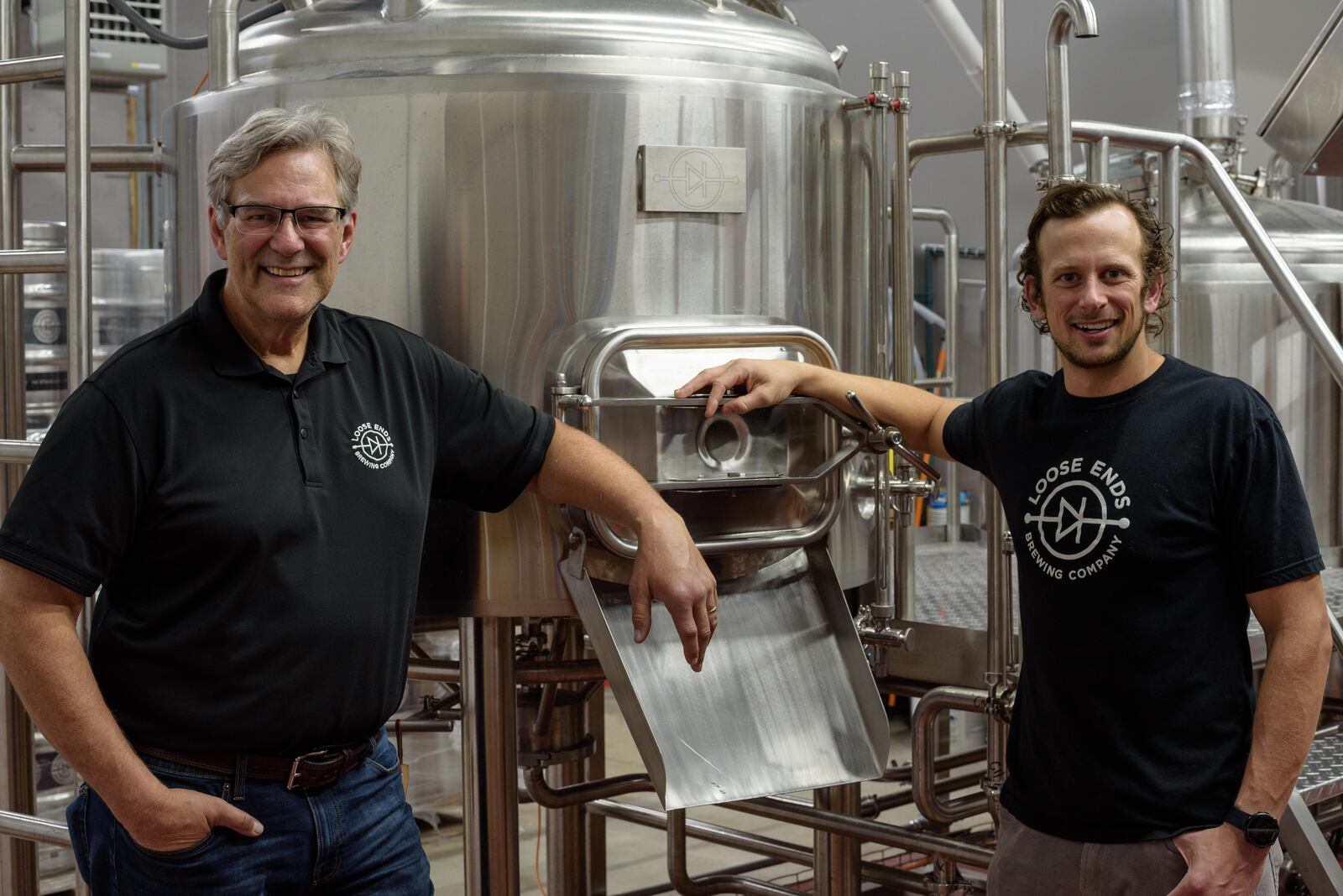 Loose Ends Brewing Company in Centerville. Pictured by the brewing tanks are John Loose and his father Kent Loose, the brewery's father/son ownership duo. TOM GILLIAM/CONTRIBUTING PHOTOGRAPHER