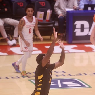 Dayton's Amaël L'Etang shoots against Bethune-Cookman on Saturday, Nov. 15, 2025, at UD Arena. David Jablonski/Staff