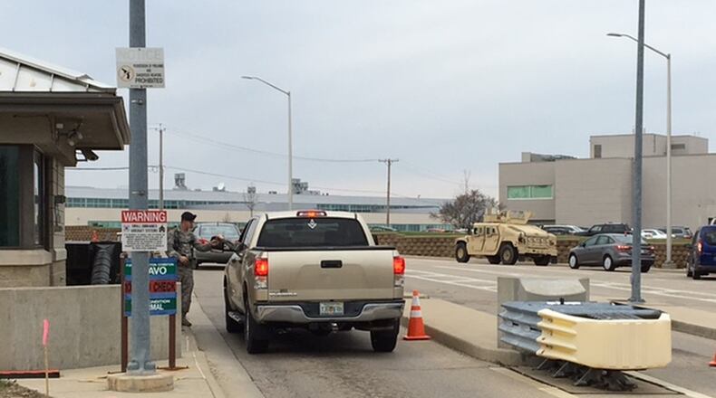 A sentry checks a driver identification at Gate 19B off National Road. The heavily traveled Wright-Patterson gate will be closed for several weeks beginning April 3. BARRIE BARBER/STAFF