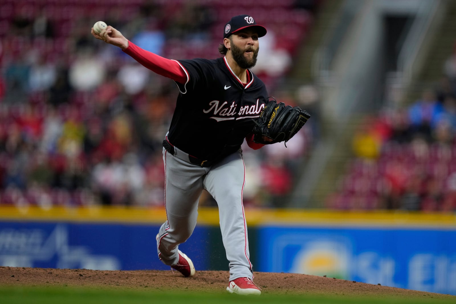 Washington Nationals pitcher Trevor Williams throws during the first inning of a baseball game against the Cincinnati Reds, Saturday, May 3, 2025, in Cincinnati. (AP Photo/Carolyn Kaster)