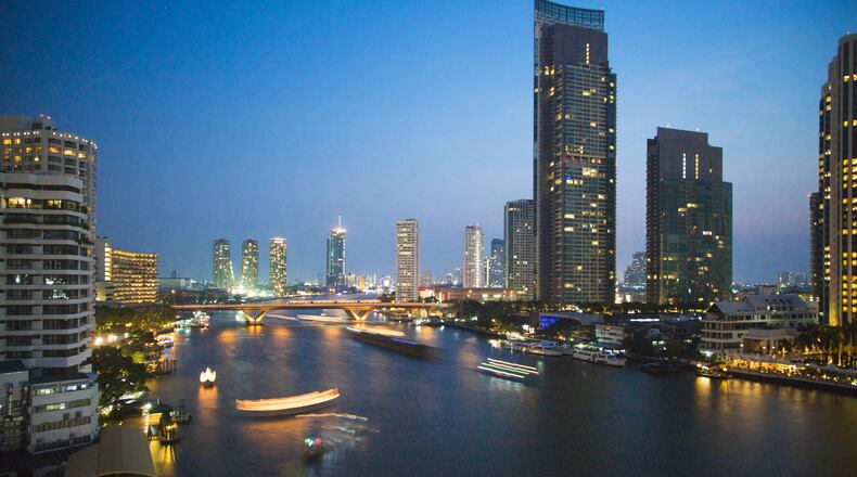Dusk along the Chao Phraya River, a view from the Mandarin Oriental, in Bangkok, March 2016. Despite recent political disorder Bangkok has emerged as the unofficial capital of Southeast Asia, and a most alluring consequence for travelers has been the revival of the Chao Phraya River in the city. (Lauryn Ishak/The New York Times)